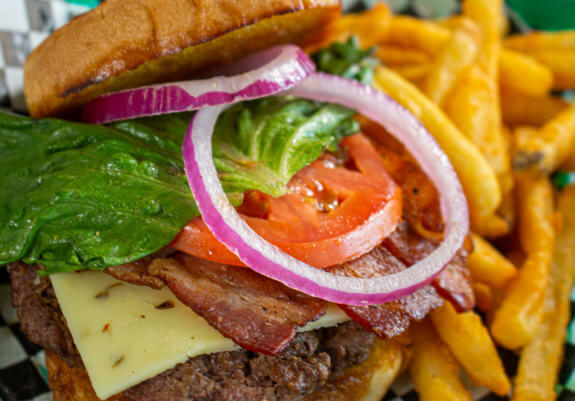 close up of cheeseburger and fries