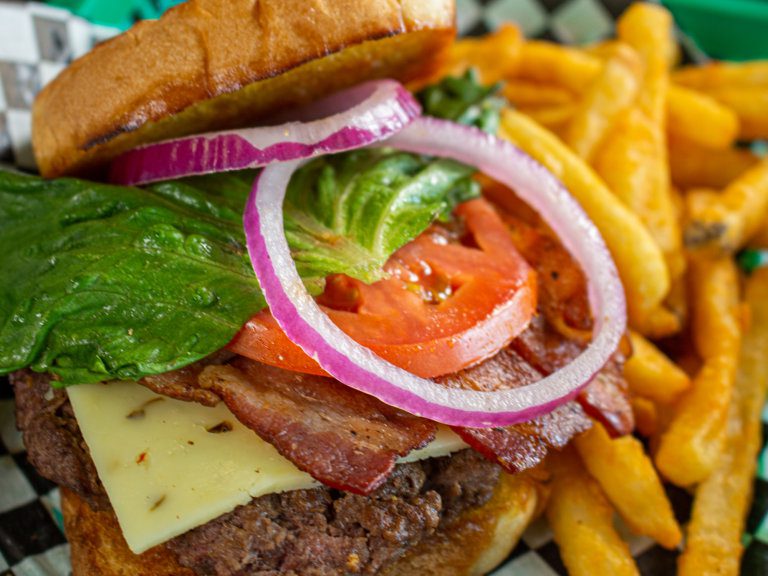close up of cheeseburger and fries