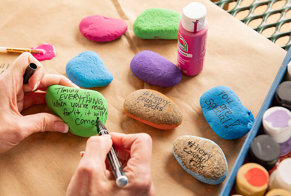 Painted rocks with painting supplies