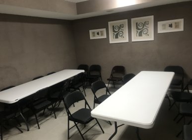 small conference room with tables and chairs