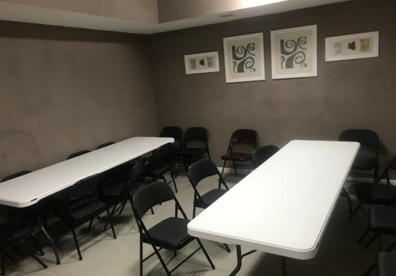 small conference room with tables and chairs