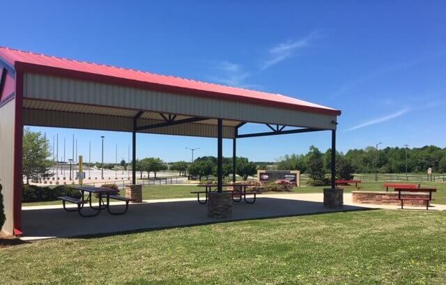 pavilion at Atlanta Motor Speedway with picnic tables and a fire pit