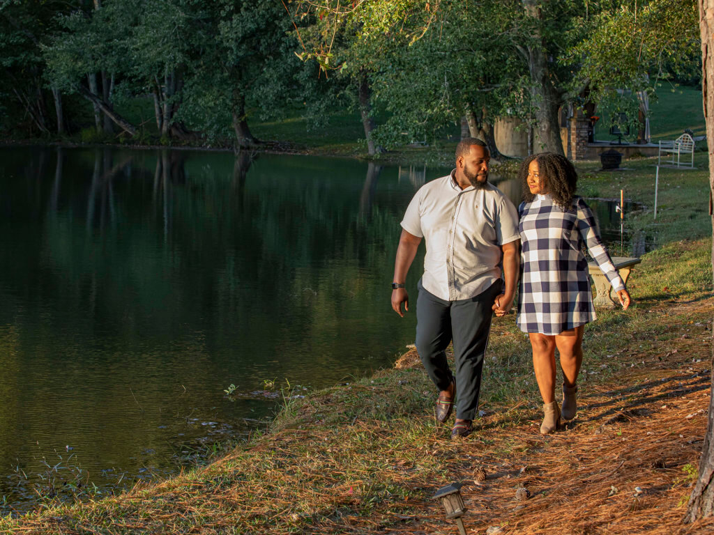 couple walks by lake