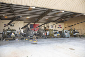 tow of helicopters in hangar