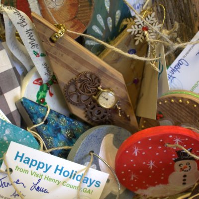 a close up on a box of wooden painted ornaments