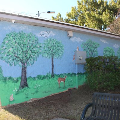 Mural with flowering locust trees deer, rabbits and squirrels