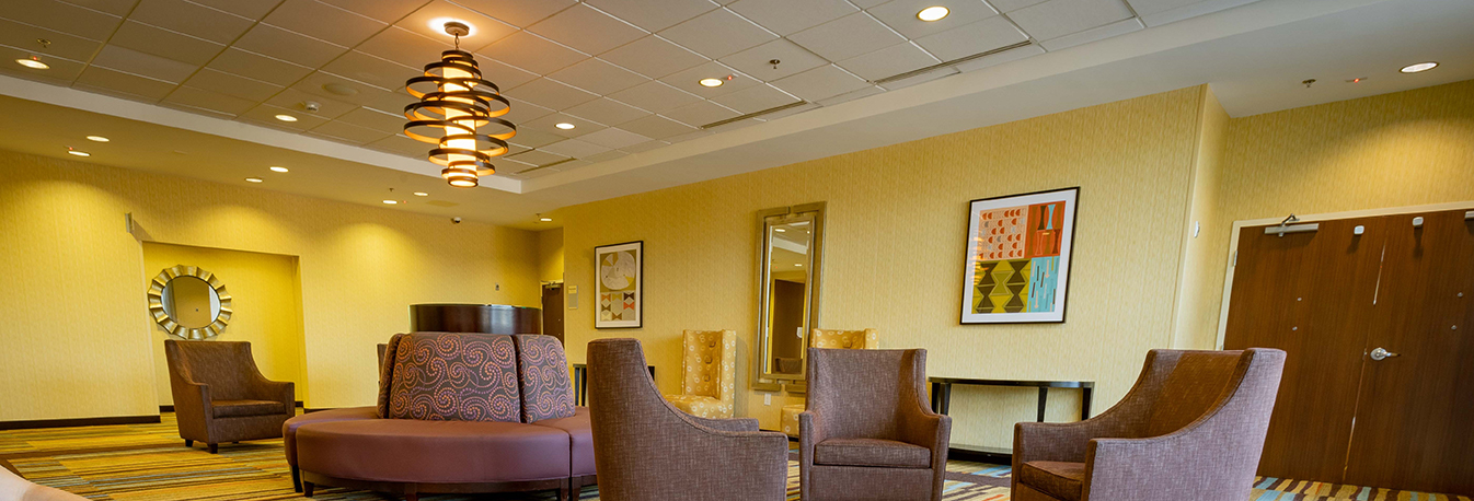 hotel event space with seating and ornate light fixture
